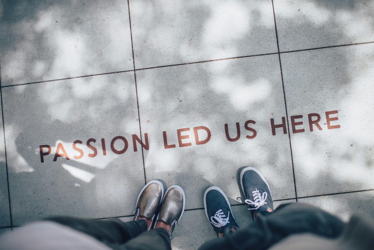 "Passion led us here" text on floor