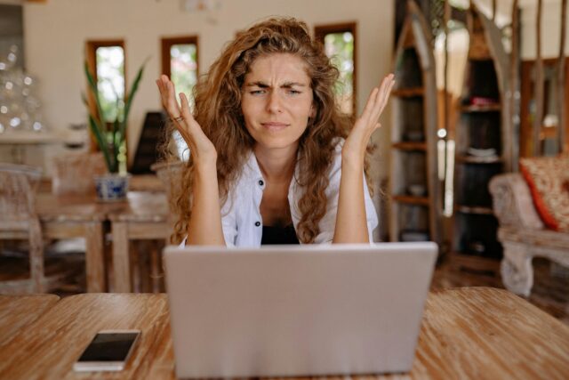 Woman looking confused at computer