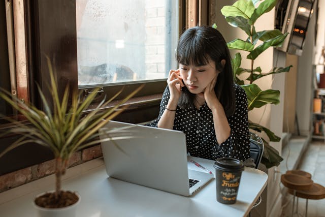 Woman at laptop looking frustrated